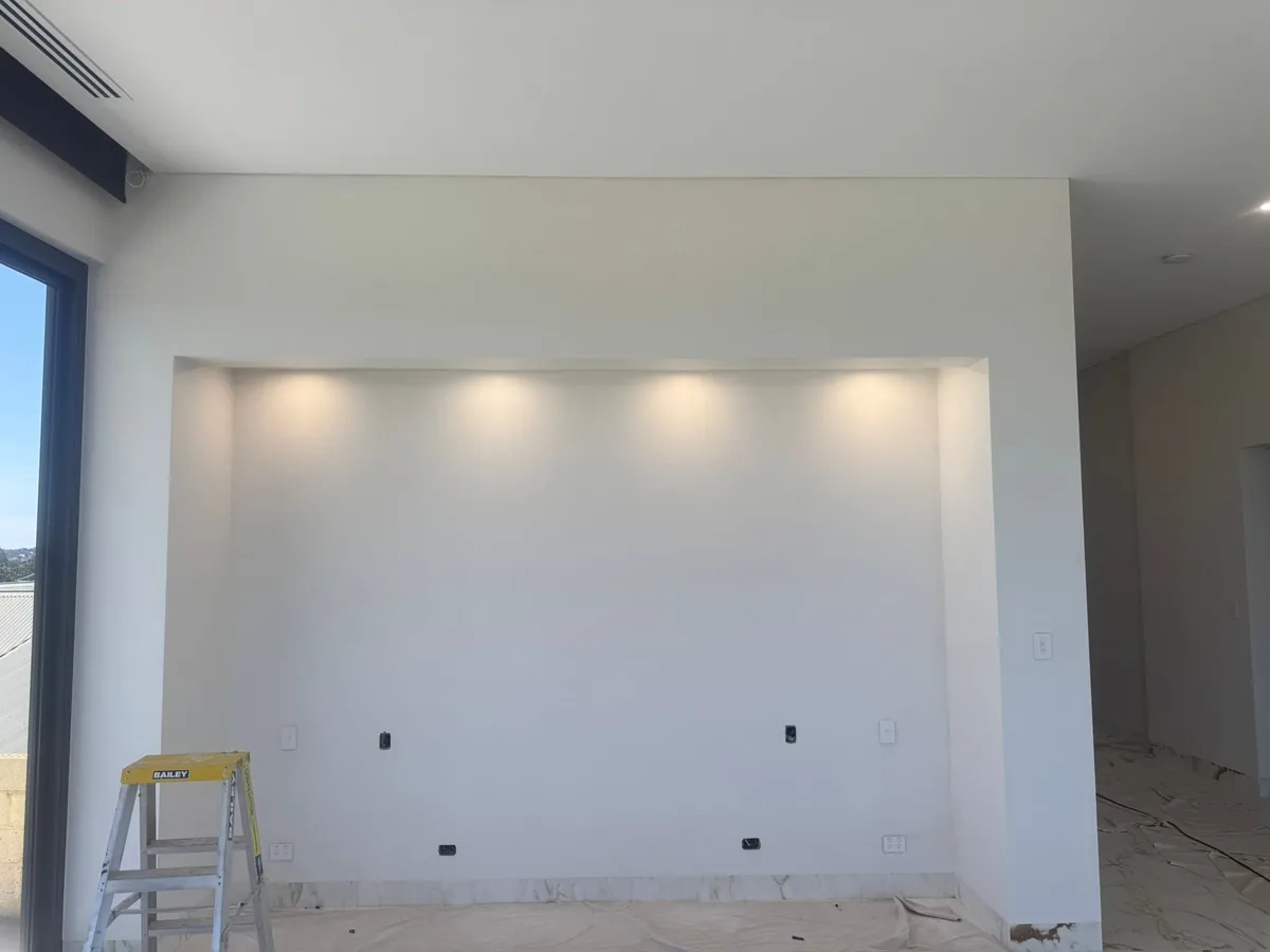Recessed feature wall niche in a new build lit with a concealed LED strip